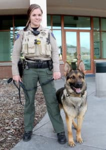 Best Reasons to Become a Cop - New police recruit working with K9 buddy