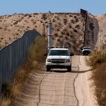 Law Enforcement And Border Patrol Confront Hundreds Of Immigrants Attempting To Enter The US Illegally